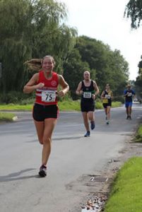 Sutton 10k runners in action on Carr Lane